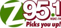 A radio station logo reads “95.1” with the slogan “Picks you up!” and “WOMZ-FM” shown in red and green.