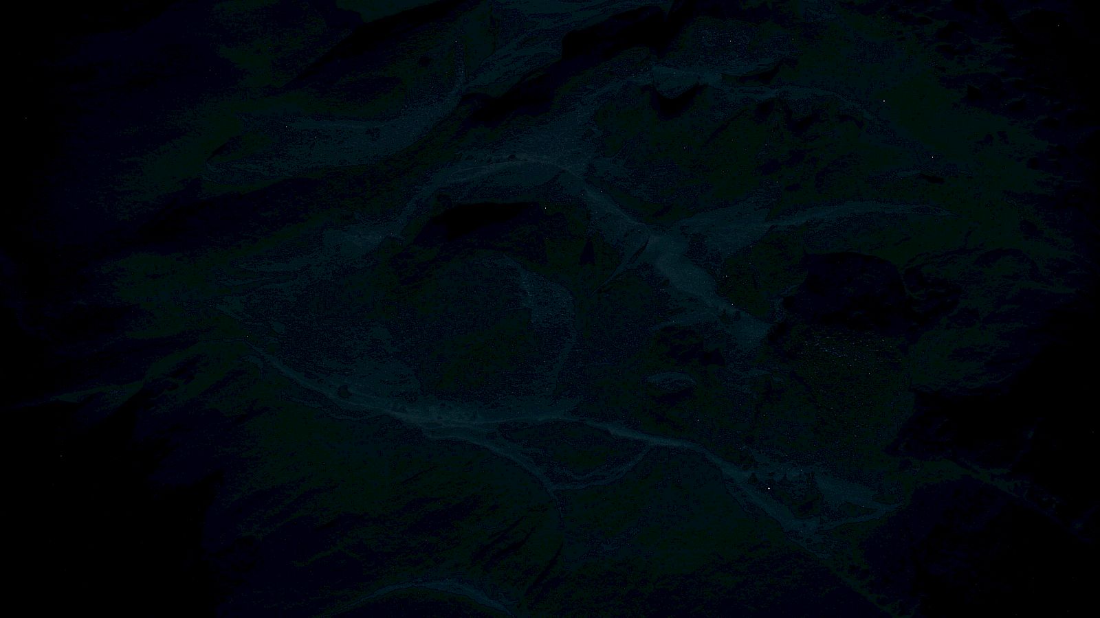 A dark, moody ocean surface with ripples and small sparkles, like stars reflected underwater.